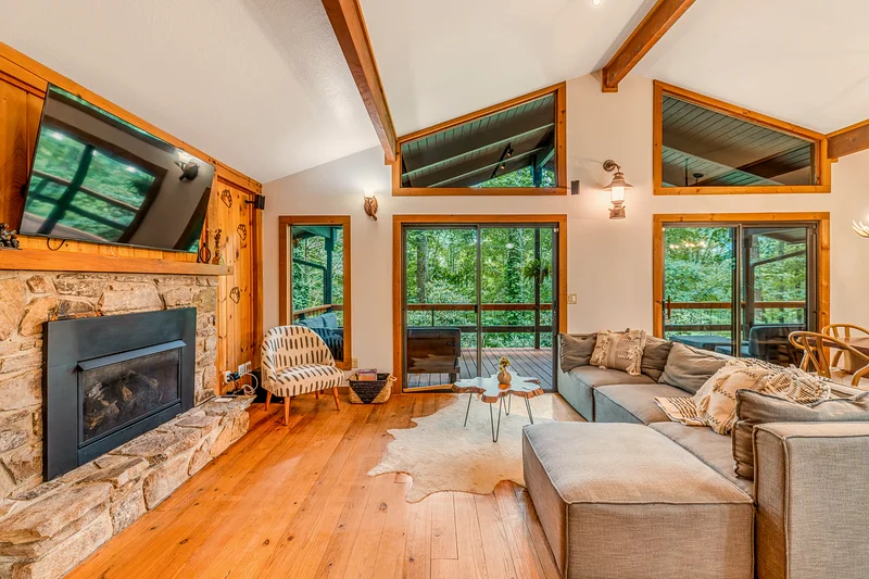 Glenway Chalet living room with stone fireplace — Maggie Valley NC