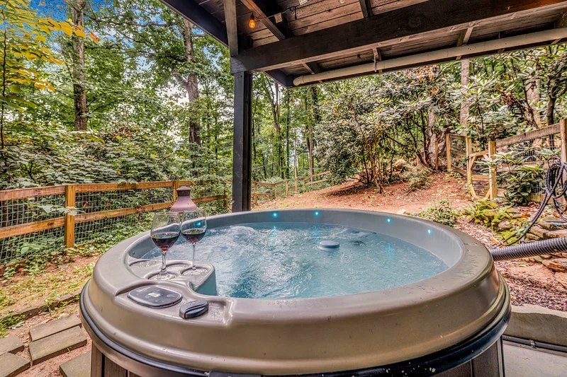 Glenway Chalet hot tub with wine glasses — Maggie Valley NC